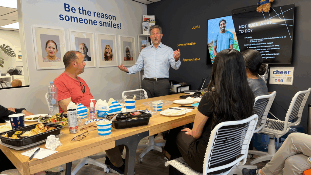 Brad Castillo from Merrill Lynch speaking to caregivers at Cheer Home Care’s Lunch & Learn event on personal financial planning.